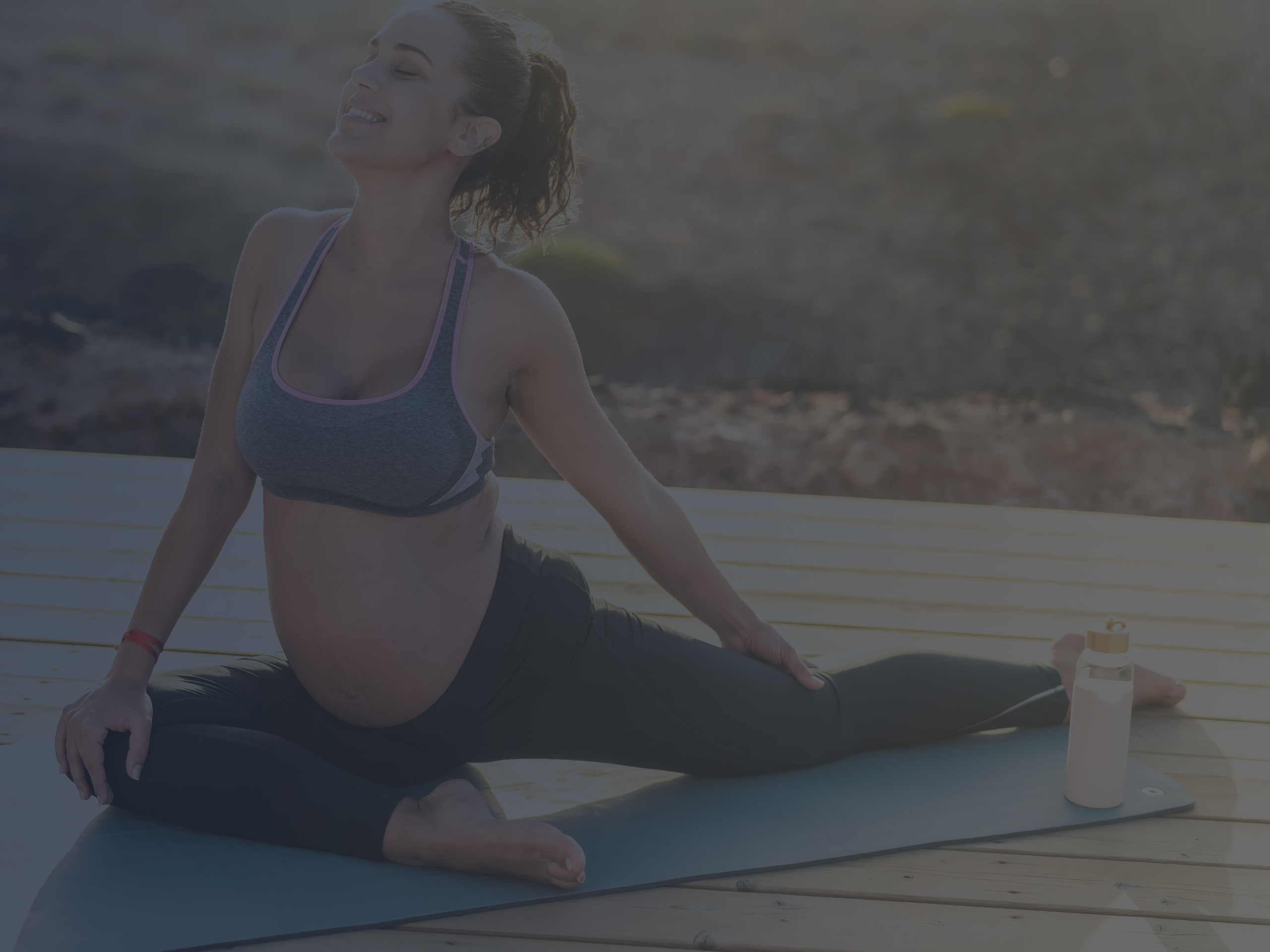 Woman in Second Trimester Doing Prenatal Pilates Exercises